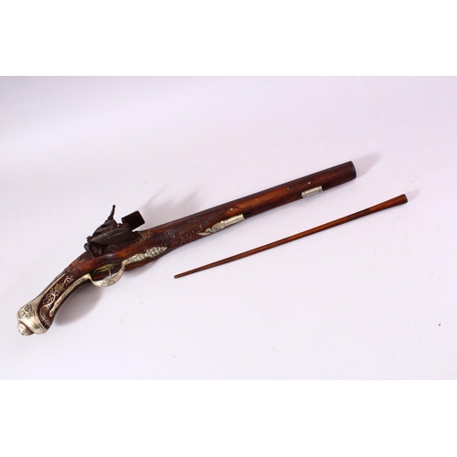 610 - AN 18TH CENTURY INDIAN FLINTLOCK PISTOL, with gold inlaid barrel, carved stone, profusely inlaid wit... 