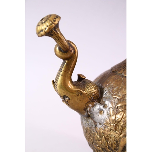 612 - A 19TH CENTURY INDIAN MOULDED BRASS JUG, with moulded elephant head spout and dog handle, the body w... 