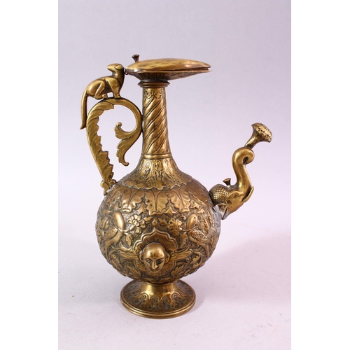 612 - A 19TH CENTURY INDIAN MOULDED BRASS JUG, with moulded elephant head spout and dog handle, the body w... 