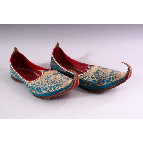 641 - A PAIR OF TURKISH EMBROIDERED LEATHER SHOES.