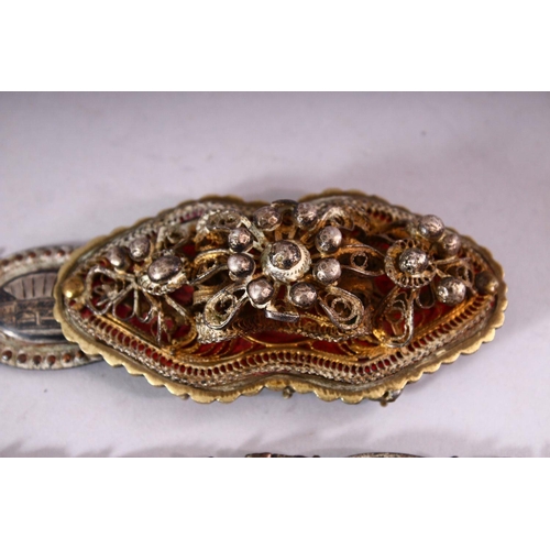 644 - A RUSSIAN NIELLO DECORATED WHITE METAL BELT with highly ornate filigree buckle and sixteen joined ov... 