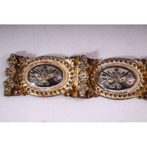 644 - A RUSSIAN NIELLO DECORATED WHITE METAL BELT with highly ornate filigree buckle and sixteen joined ov... 