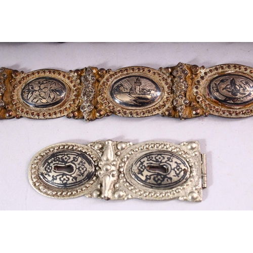 644 - A RUSSIAN NIELLO DECORATED WHITE METAL BELT with highly ornate filigree buckle and sixteen joined ov... 