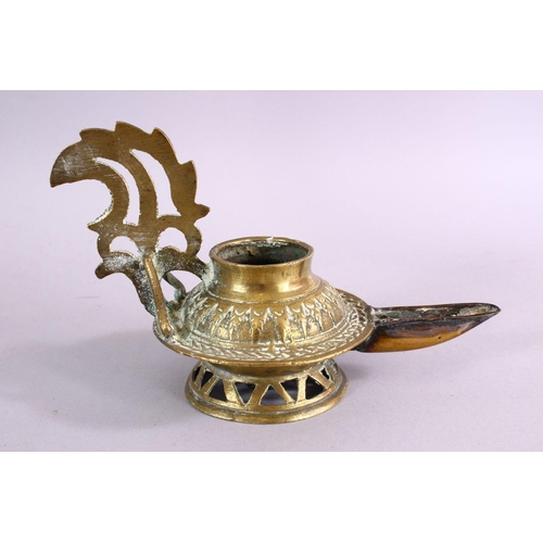 654 - AN UNUSUAL EARLY ISLAMIC POSSIBLY ANDALUSIAN SPANISH BRASS OIL LAMP, with moulded decoration, 17cm w... 