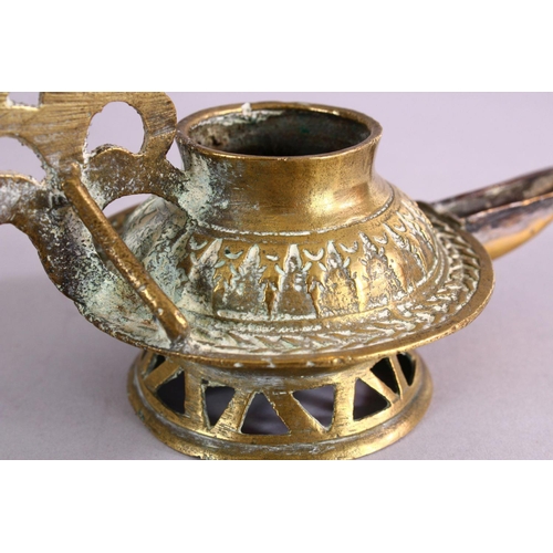 654 - AN UNUSUAL EARLY ISLAMIC POSSIBLY ANDALUSIAN SPANISH BRASS OIL LAMP, with moulded decoration, 17cm w... 