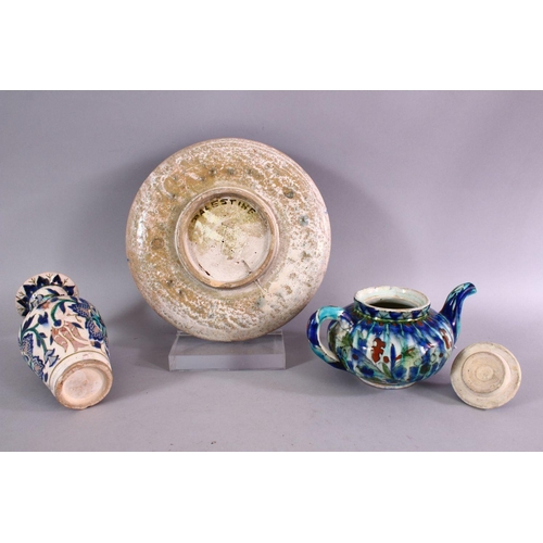 655 - A COLLECTION OF THREE PALESTINIAN / JERUSALEM POTTERY ITEMS, consisting of a tea pot, 20cm wide, a p... 