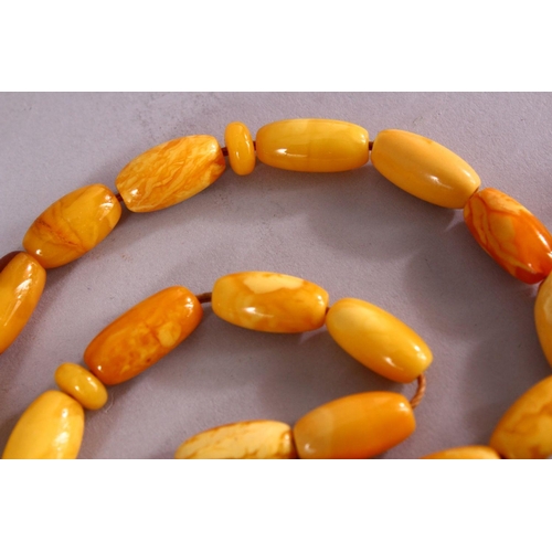 659 - A COLLECTION OF TWO ISLAMIC POSSIBLY OTTOMAN AMBER PRAYER BEADS AND ANOTHER POSSIBLY CHERRY AMBER BA... 