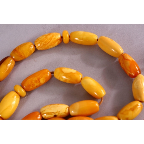 659 - A COLLECTION OF TWO ISLAMIC POSSIBLY OTTOMAN AMBER PRAYER BEADS AND ANOTHER POSSIBLY CHERRY AMBER BA... 