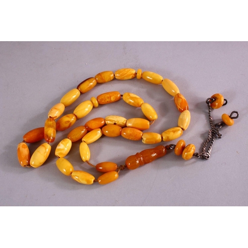 659 - A COLLECTION OF TWO ISLAMIC POSSIBLY OTTOMAN AMBER PRAYER BEADS AND ANOTHER POSSIBLY CHERRY AMBER BA... 