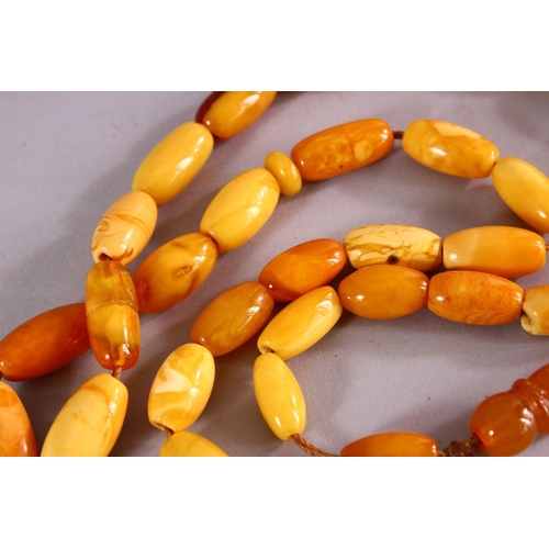 659 - A COLLECTION OF TWO ISLAMIC POSSIBLY OTTOMAN AMBER PRAYER BEADS AND ANOTHER POSSIBLY CHERRY AMBER BA... 