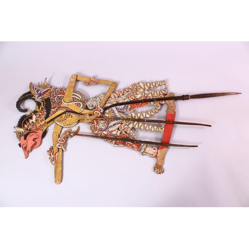 664 - A LARGE 19TH CENTURY INDONESIAN SHADOW PUPPET WITH RHINO HORN STICKS, 73cm.