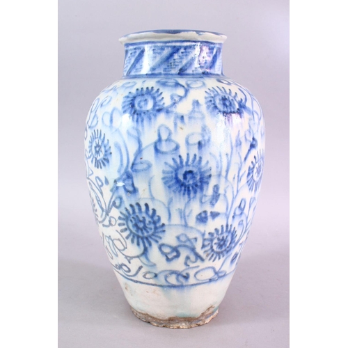 665 - A LARGE 18TH CENTURY PERSIAN SAFAVID BLUE & WHITE GLAZED POTTERY VASE, the vase decorated with styli... 