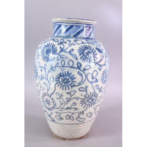 665 - A LARGE 18TH CENTURY PERSIAN SAFAVID BLUE & WHITE GLAZED POTTERY VASE, the vase decorated with styli... 