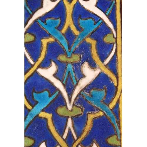 669 - A 15TH CENTURY PERSIAN OR CENTRAL ASIAN TIMURID CUERDA SECA TILE, the tile with stylized motif decor... 