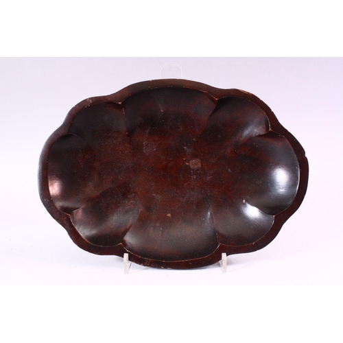 678 - A CARVED WOOD BOWL OF LOBED OVAL FORM, 29cm x 20cm.