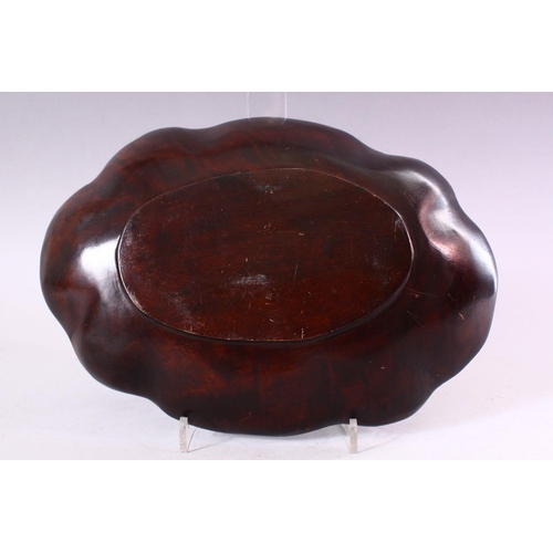 678 - A CARVED WOOD BOWL OF LOBED OVAL FORM, 29cm x 20cm.