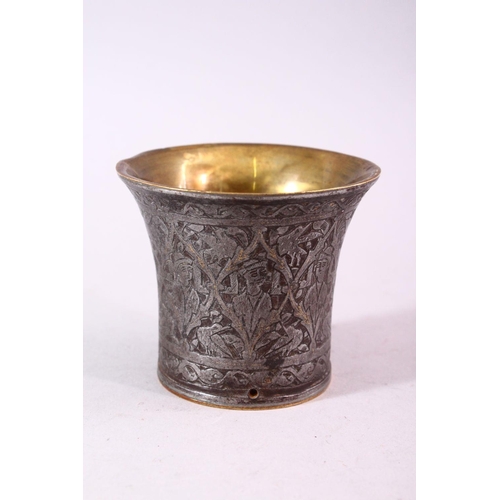 680 - A SMALL BRASS AND ENGRAVED STEEL BEAKER SHAPED VESSEL, the exterior engraved with figures, 7.5cm dia... 