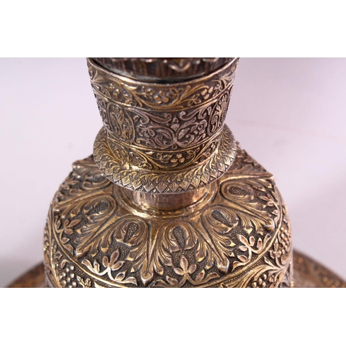 683 - A FINE 19TH CENTURY INDIAN SILVER AND GILT HUQQA BASE, pierced with floral decoration, with two late... 