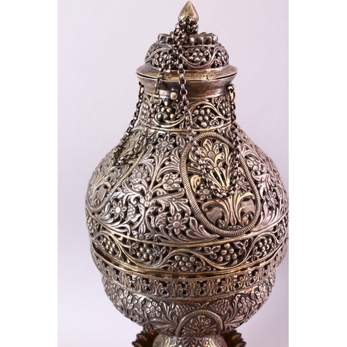 683 - A FINE 19TH CENTURY INDIAN SILVER AND GILT HUQQA BASE, pierced with floral decoration, with two late... 