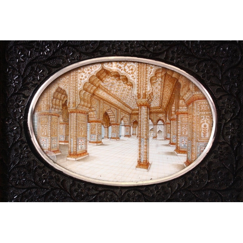 685 - A GOOD LATE 19TH CENTURY INDIAN OVAL MINIATURE PAINTING ON IVORY depicting an architectural interior... 