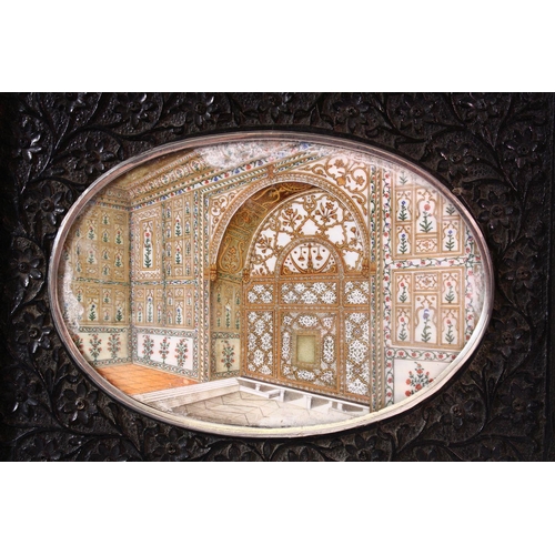 686 - A GOOD LATE 19TH CENTURY INDIAN OVAL MINIATURE PAINTING ON IVORY depicting an architectural interior... 