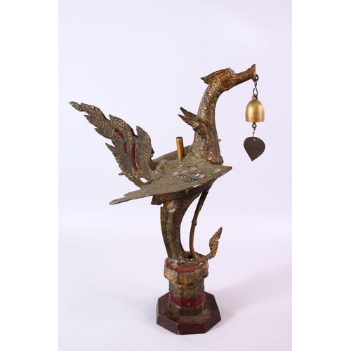 697 - AN INDONESIAN CAST AND GILDED TEMPLE BELL IN THE FORM OF A BIRD standing with outspread wings and be... 