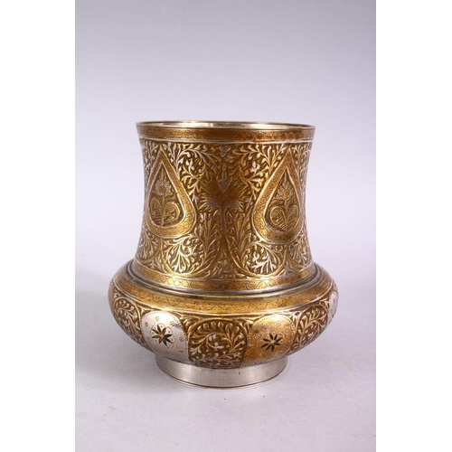 699 - A SMALL INDIAN ENGRAVED BRASS AND WHITE METAL CIRCULAR VASE, 11cm high.