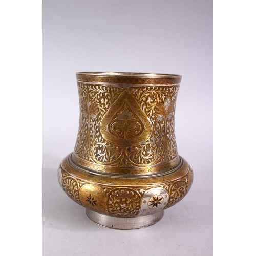 699 - A SMALL INDIAN ENGRAVED BRASS AND WHITE METAL CIRCULAR VASE, 11cm high.