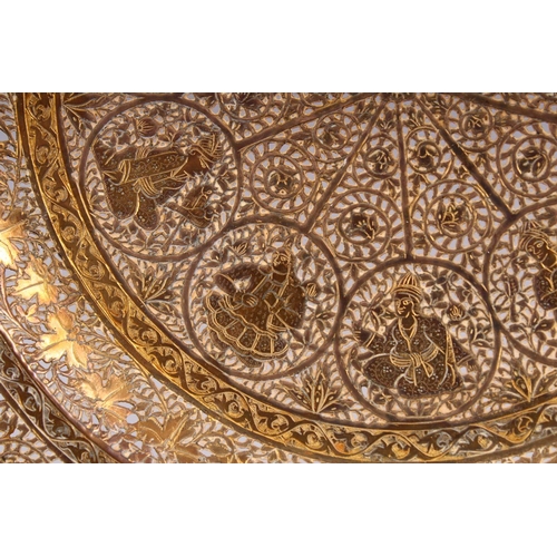 700 - A GOOD INDIAN PIERCED GILDED WHITE METAL CIRCULAR DISH, 23cm diameter.