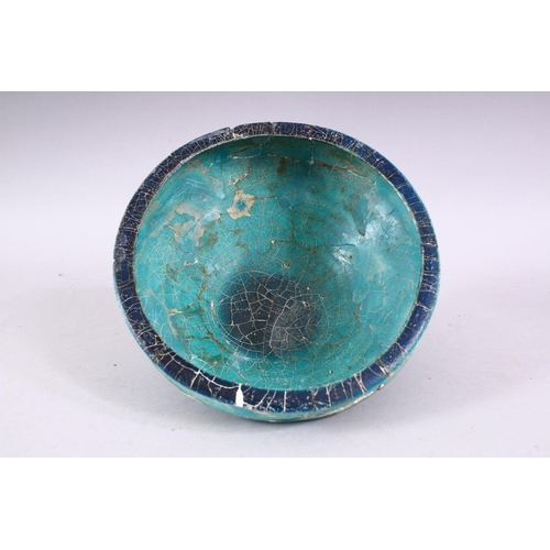 701 - AN EARLY PERSIAN OTTOMAN TURQUOISE GLAZED POTTERY BOWL (repairs and restoration), 19cm diameter.