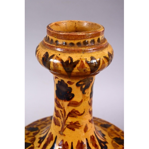 702 - AN ISLAMIC POTTERY VASE, with bands of floral decoration, 25cm high.