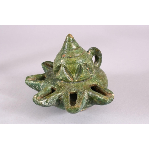 712 - A UNUSUAL EARLY ISLAMIC POTTERY OIL LAMP ON STAND, 46cm high.