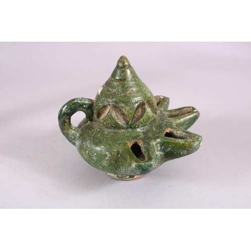 712 - A UNUSUAL EARLY ISLAMIC POTTERY OIL LAMP ON STAND, 46cm high.