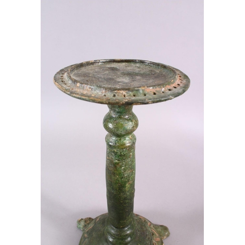 712 - A UNUSUAL EARLY ISLAMIC POTTERY OIL LAMP ON STAND, 46cm high.