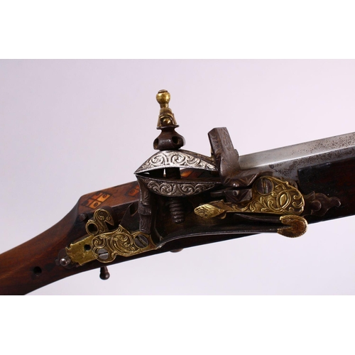 714 - A LONG 19TH CENTURY NORTH AFRICAN RIFLE, with gilt metal mounts, octagonal barrel, with bone and sil... 