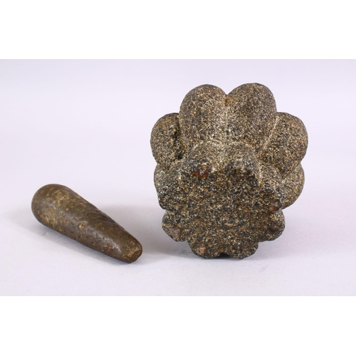 727 - AN EARLY ISLAMIC POSSIBLY ANDALUSIAN HISPANO MORESQUE STONE PESTLE AND MORTAR, mortar: 8.5cm 11.5cm.