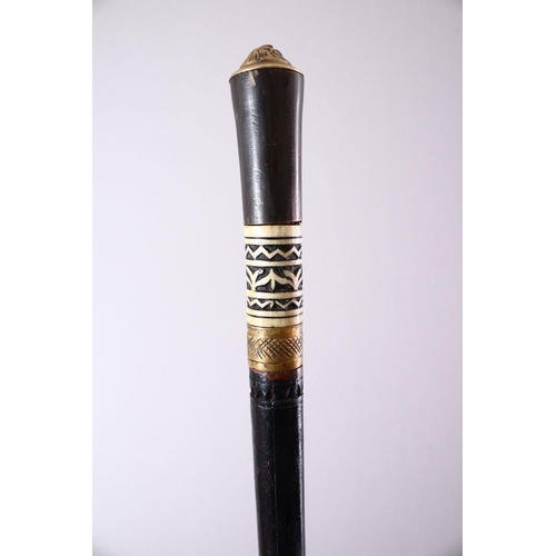 736 - AN INDIAN EBONY, BONE AND HORN MOUNTED SWORD STICK, 91cm long.