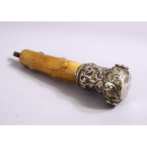 74 - A 19TH CENTURY RHINOCEROS HORN & SILVER PARASOL HANDLE, 11cm.