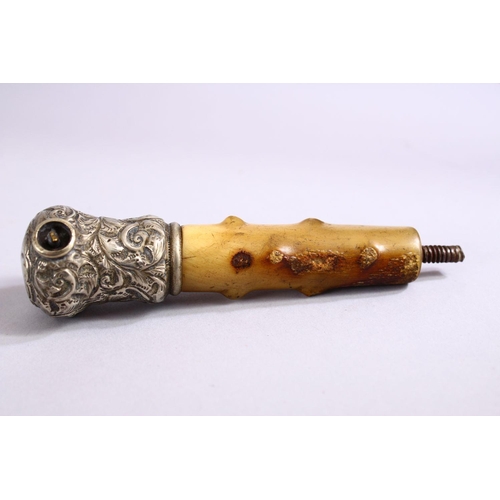 74 - A 19TH CENTURY RHINOCEROS HORN & SILVER PARASOL HANDLE, 11cm.