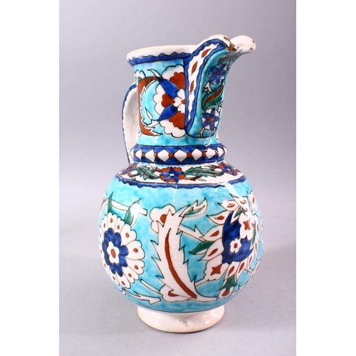 742 - A 19TH CENTURY KUTAHYA JUG, decorated in the Iznik taste, 26cm high.