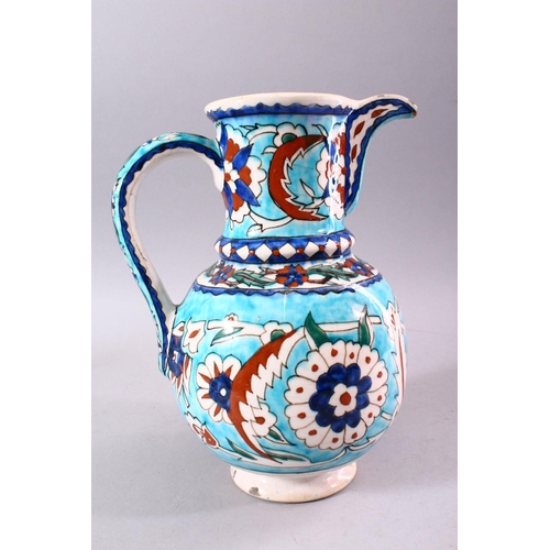 742 - A 19TH CENTURY KUTAHYA JUG, decorated in the Iznik taste, 26cm high.