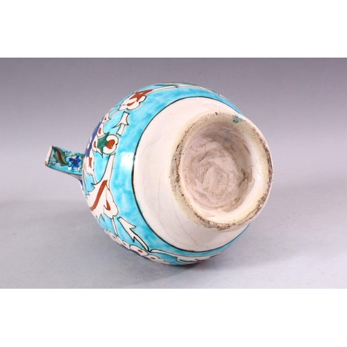 742 - A 19TH CENTURY KUTAHYA JUG, decorated in the Iznik taste, 26cm high.