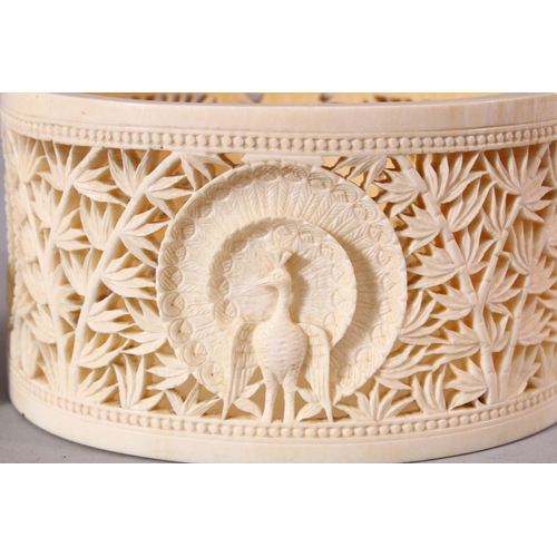 744 - A FINE EARLY 20TH CENTURY IVORY TUSK BOX AND COVER, the cover pierced and carved with a peacock, the... 