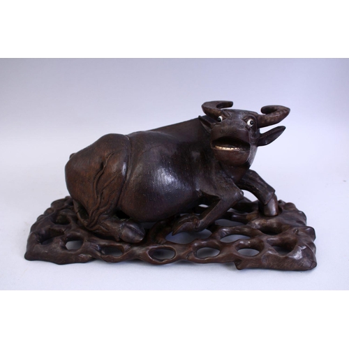 75 - A GOOD 19TH CENTURY CHINESE CARVED HARDWOOD AND INLAID SILVER WATER BUFFALO, the buffalo recumbent w... 