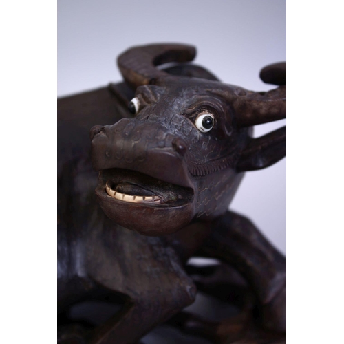 75 - A GOOD 19TH CENTURY CHINESE CARVED HARDWOOD AND INLAID SILVER WATER BUFFALO, the buffalo recumbent w... 