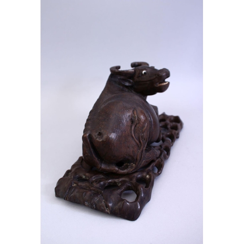 75 - A GOOD 19TH CENTURY CHINESE CARVED HARDWOOD AND INLAID SILVER WATER BUFFALO, the buffalo recumbent w... 