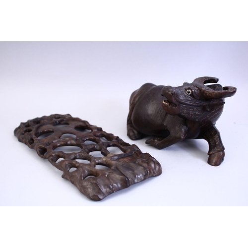 75 - A GOOD 19TH CENTURY CHINESE CARVED HARDWOOD AND INLAID SILVER WATER BUFFALO, the buffalo recumbent w... 