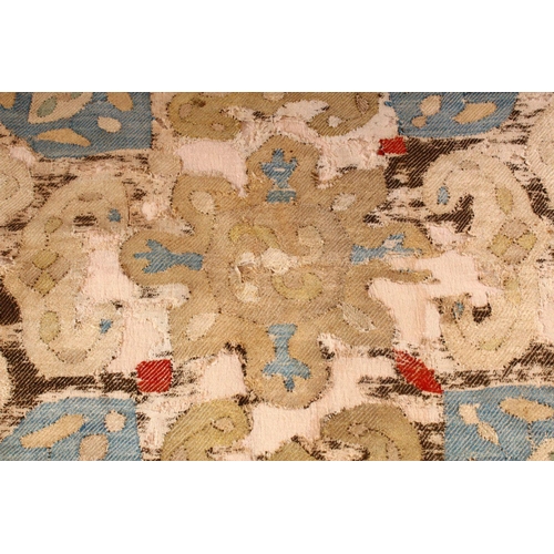 754 - AN EARLY CAUCASIAN SMALL RUG, with beige ground and stylised motifs within a narrow blue ground bord... 