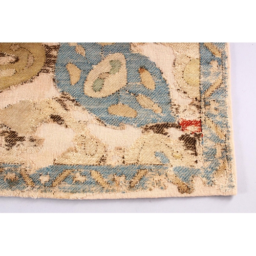 754 - AN EARLY CAUCASIAN SMALL RUG, with beige ground and stylised motifs within a narrow blue ground bord... 