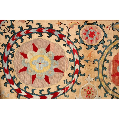 755 - AN EARLY SUZANI TEXTILE consisting of five stitched panels embroidered with palmettes and stylised f... 